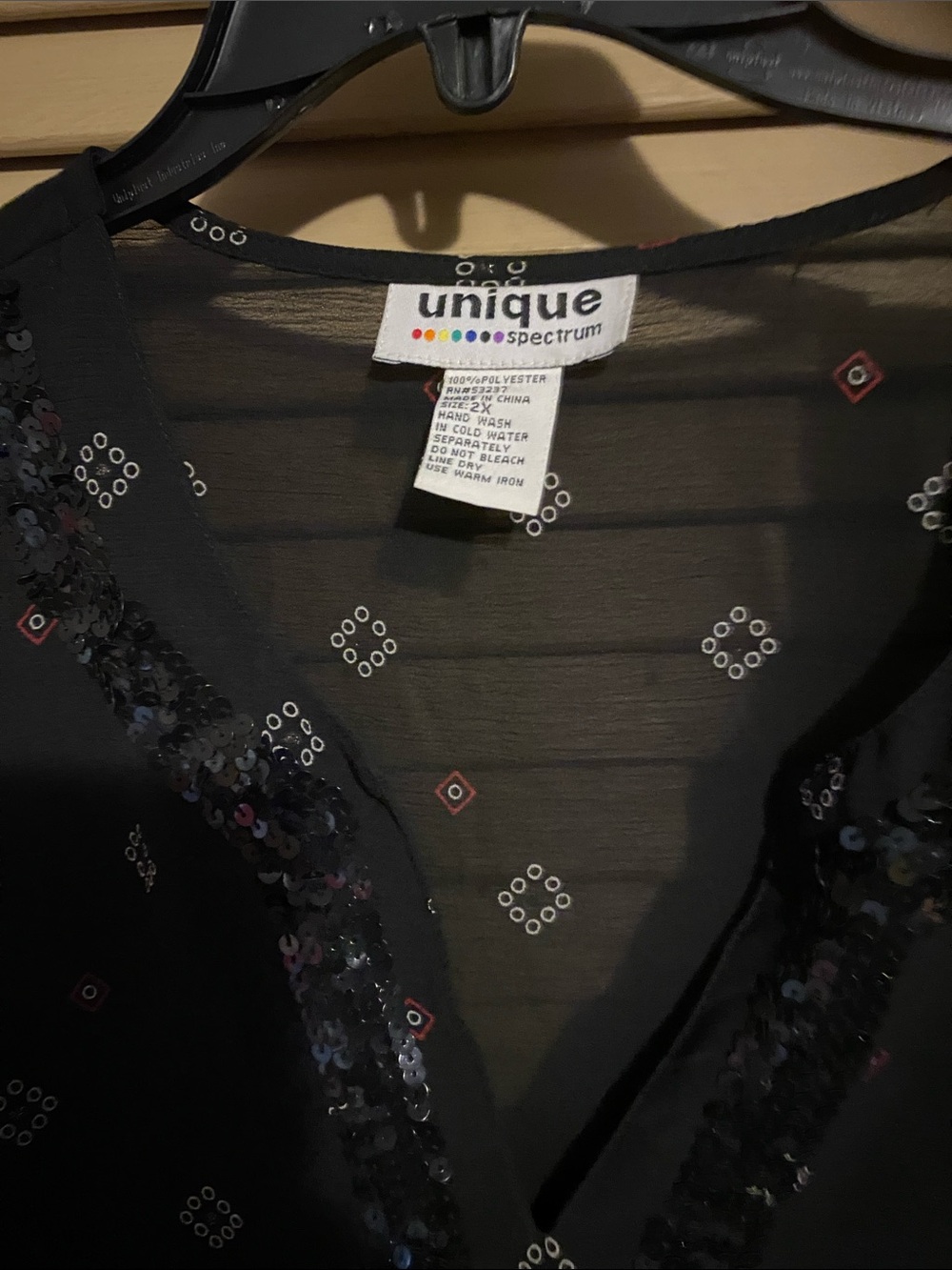 Unique Spectrum Sheer Black top with Sequin Trim